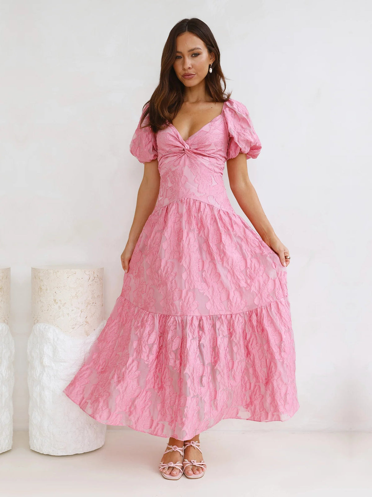 Pink V-neck tiered maxi dress with puff sleeves and layered skirt