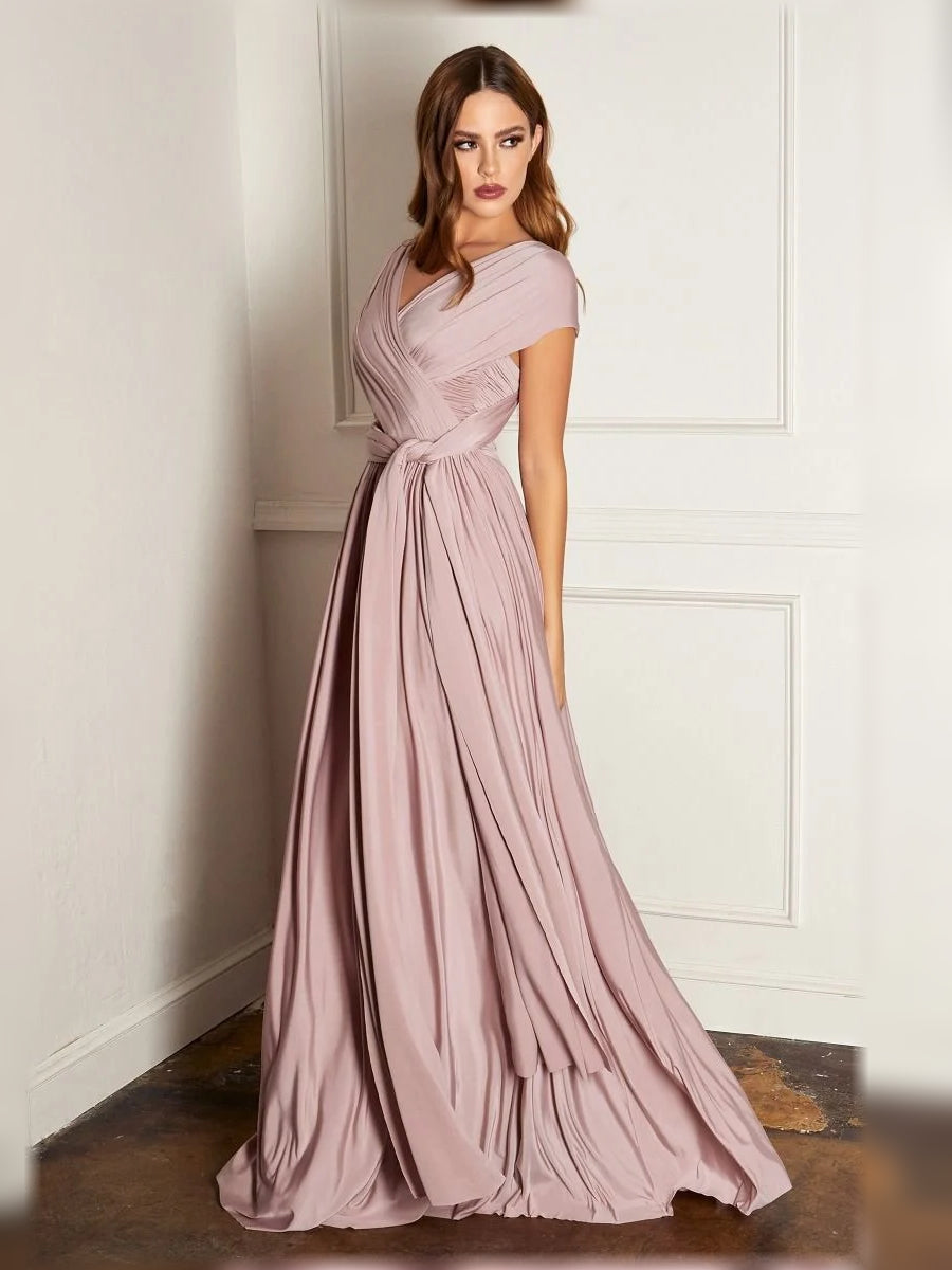 Mauve halter formal dress with draped neckline, ruched waist, and pleated floor skirt