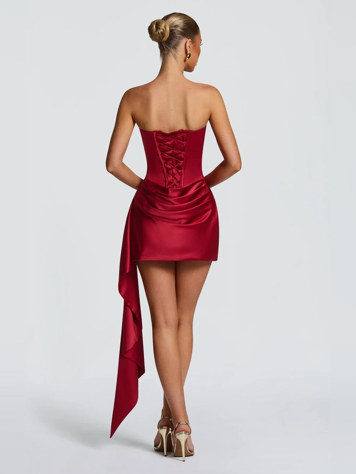 Deep red strapless satin mini bodycon dress with draped corset back and side sash