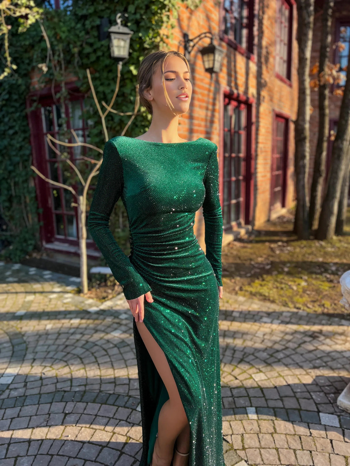 Dark green ruched floor-length formal dress with wide neckline and front slit