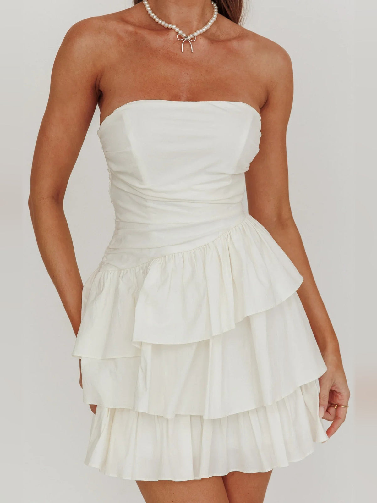 Ivory strapless ruched bodice with tiered ruffle mini skirt