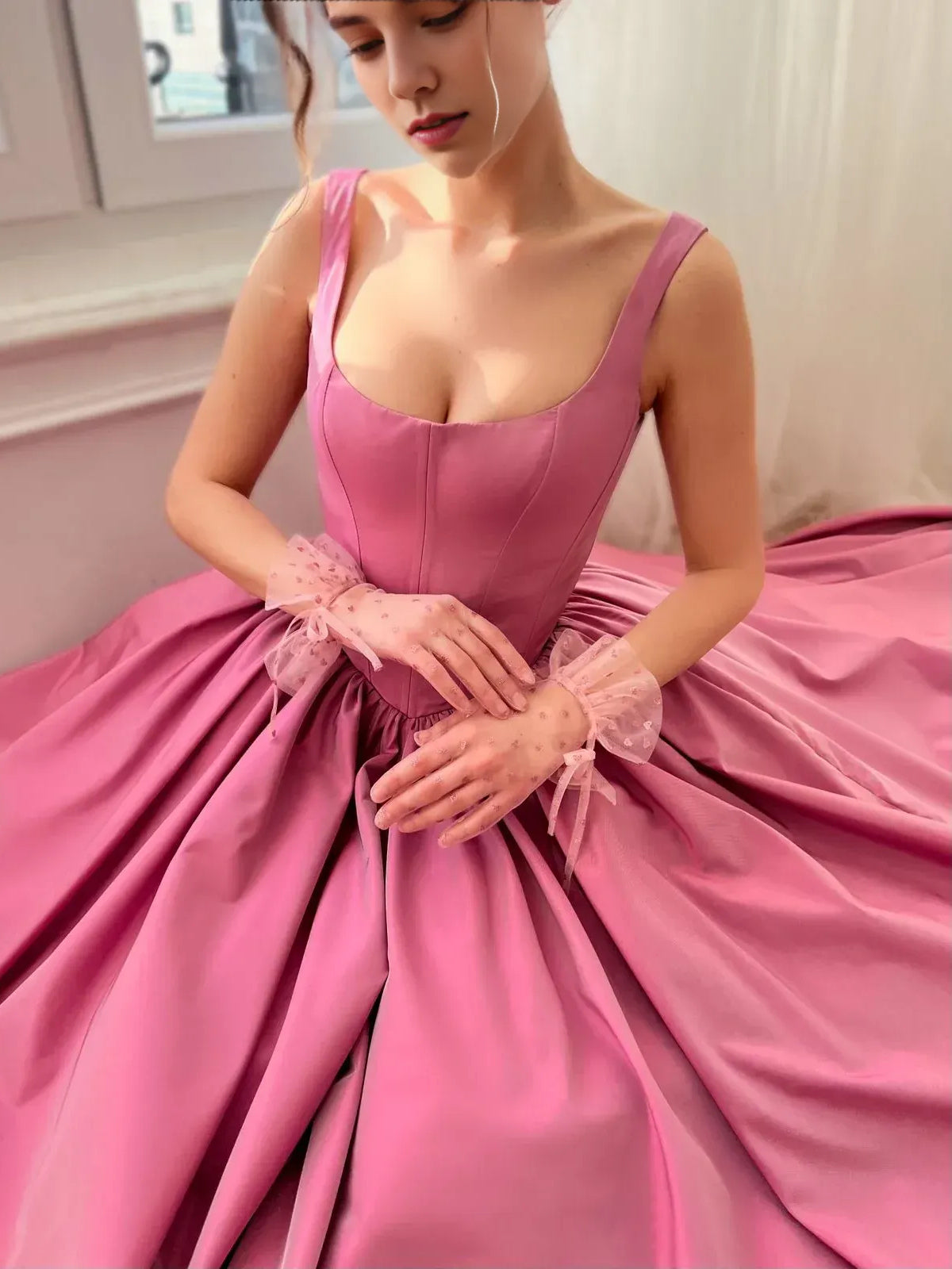 Hot pink satin A-line maxi dress with sweetheart neckline and tulle bow at waist