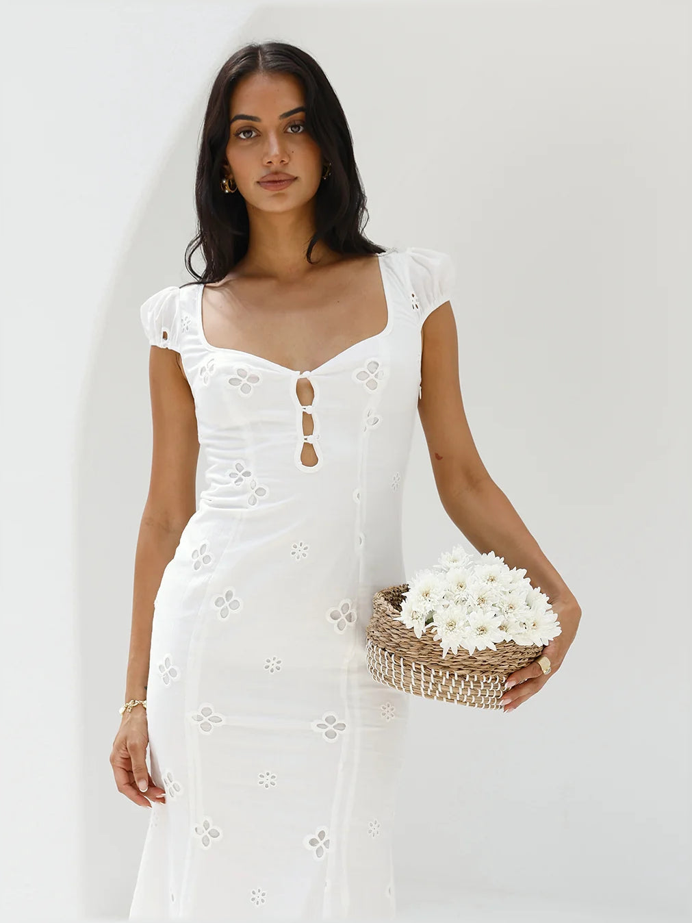 White midi formal dress with square neckline, short puff sleeves, eyelet panels, keyhole