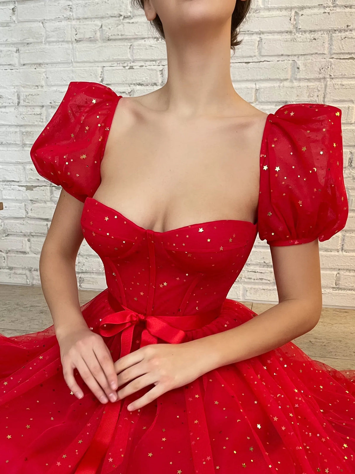 Red sweetheart corset bodice with puff sleeves, sparkle dots, and red bow waist