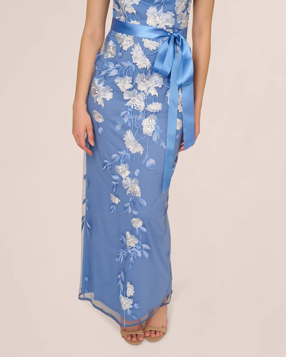 Blue floral A-line maxi dress with ribbon sash and draped skirt