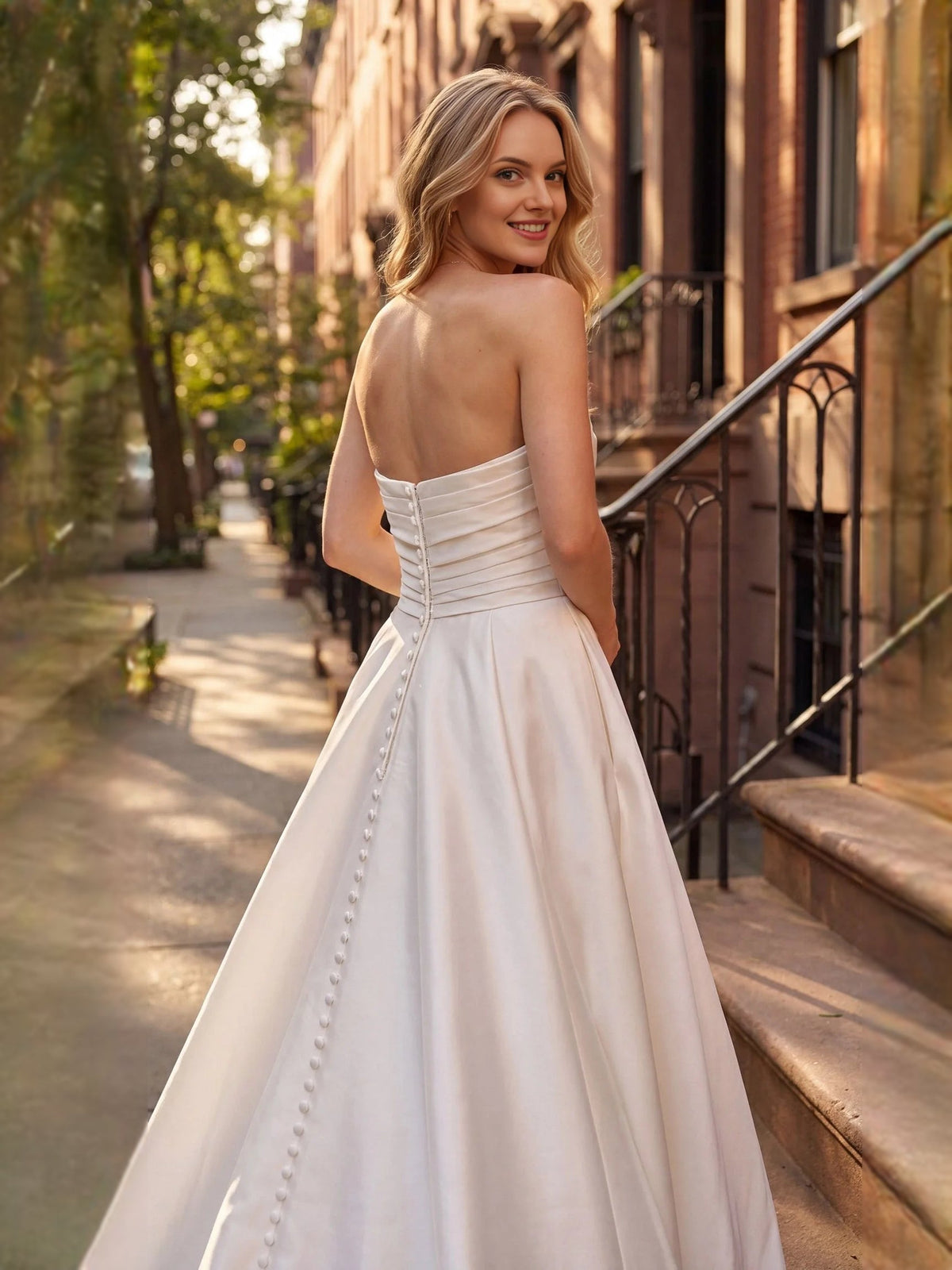 Ivory satin wedding dress with sweetheart neckline, ruched bodice, sleeveless, column skirt