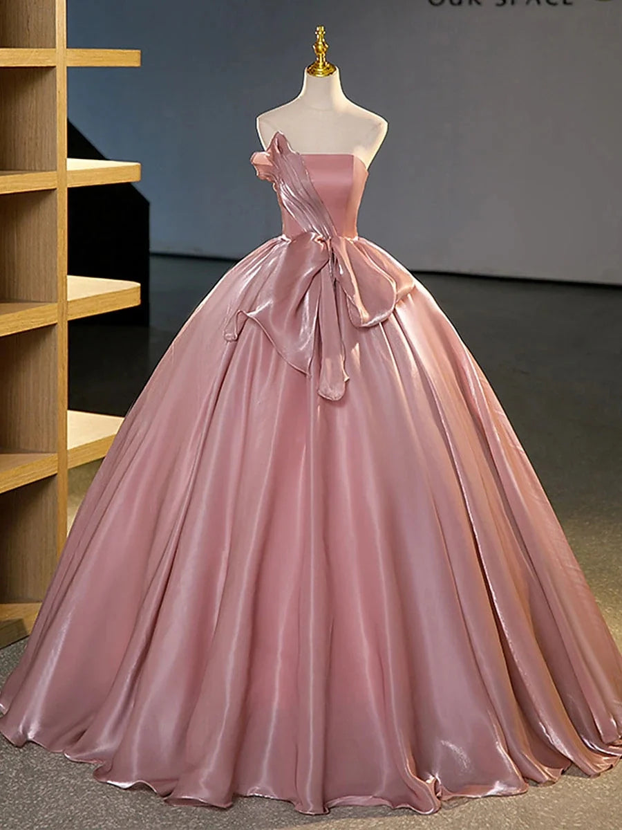 Mannequin wearing blush pink satin strapless corset bow A-line floor-length prom dress