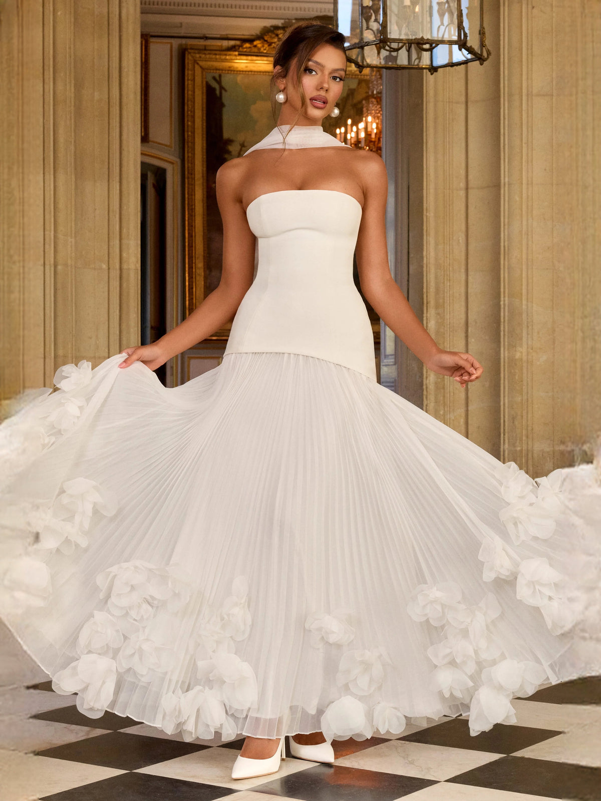 Ivory strapless corset wedding dress with pleated skirt and large layered floral ruffle detail