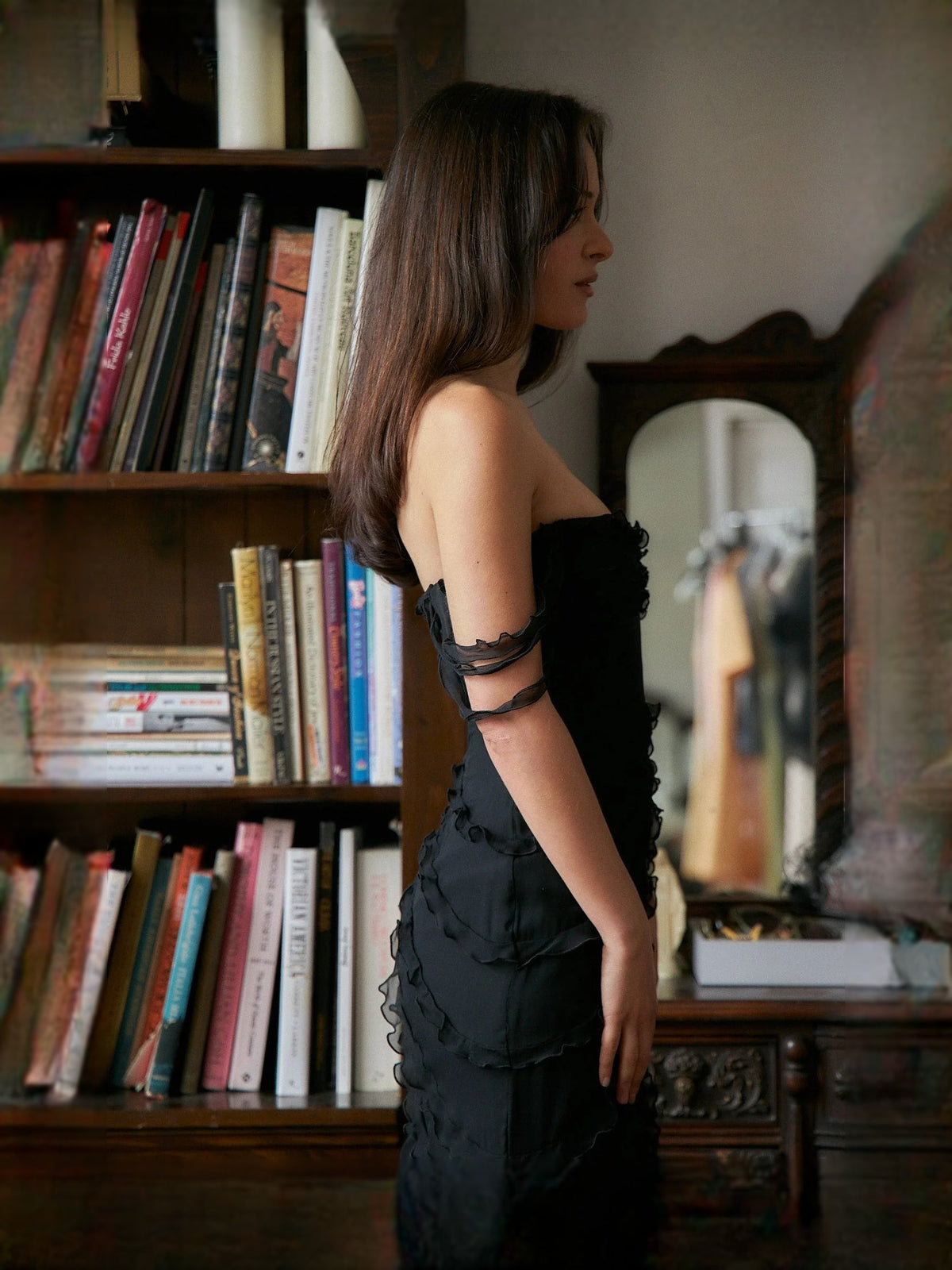 Black strapless mermaid prom dress with layered ruffles and off-shoulder strap detail