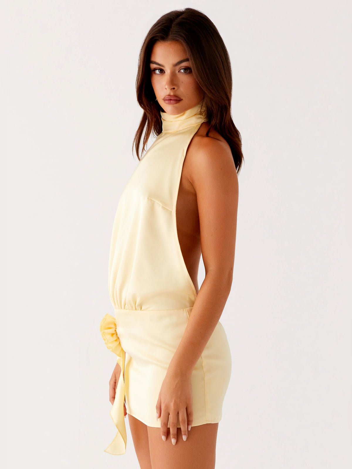 Yellow halter mini dress in side profile