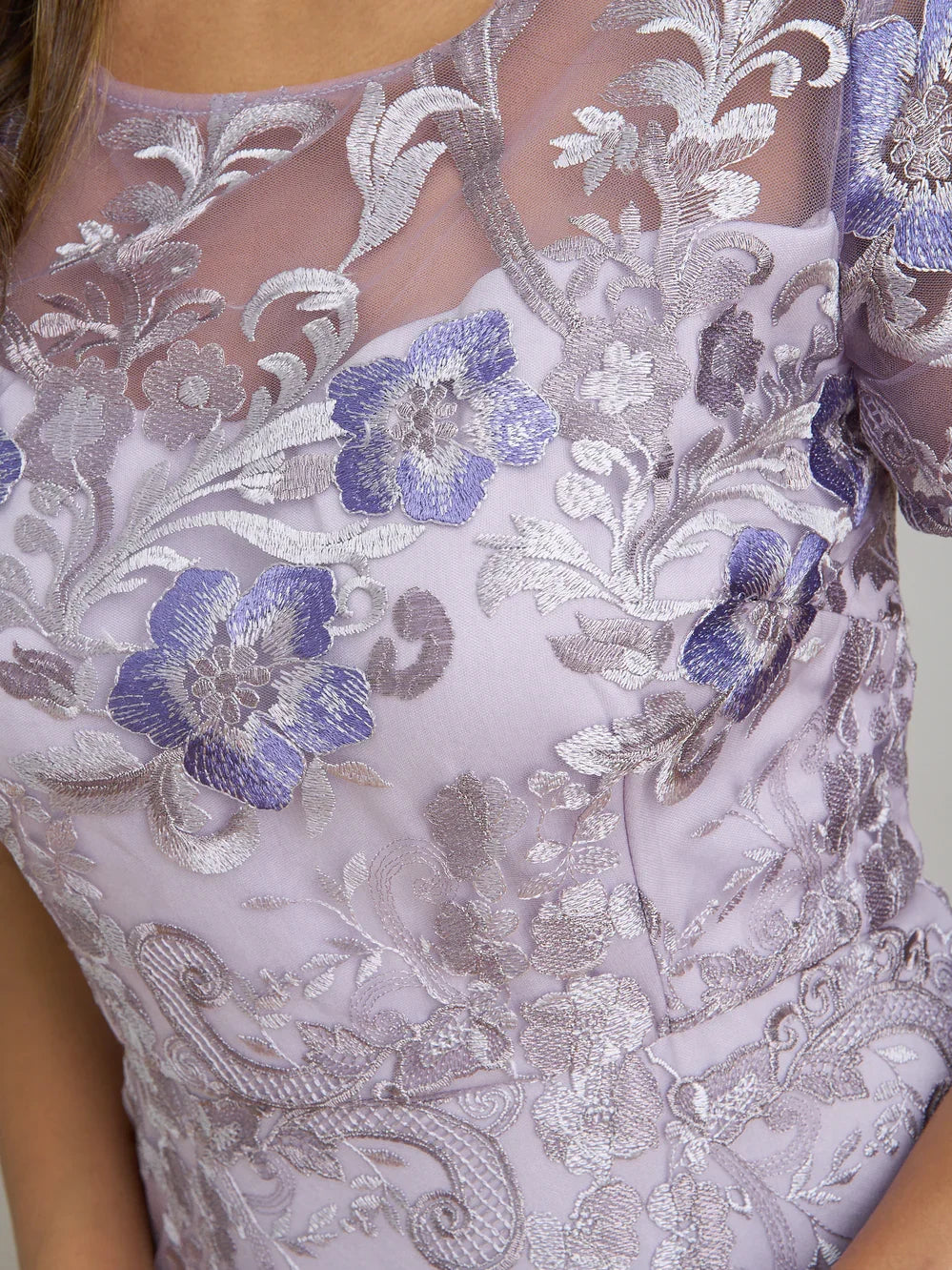 Lavender embroidered bodice with square neckline and blue floral applique detail