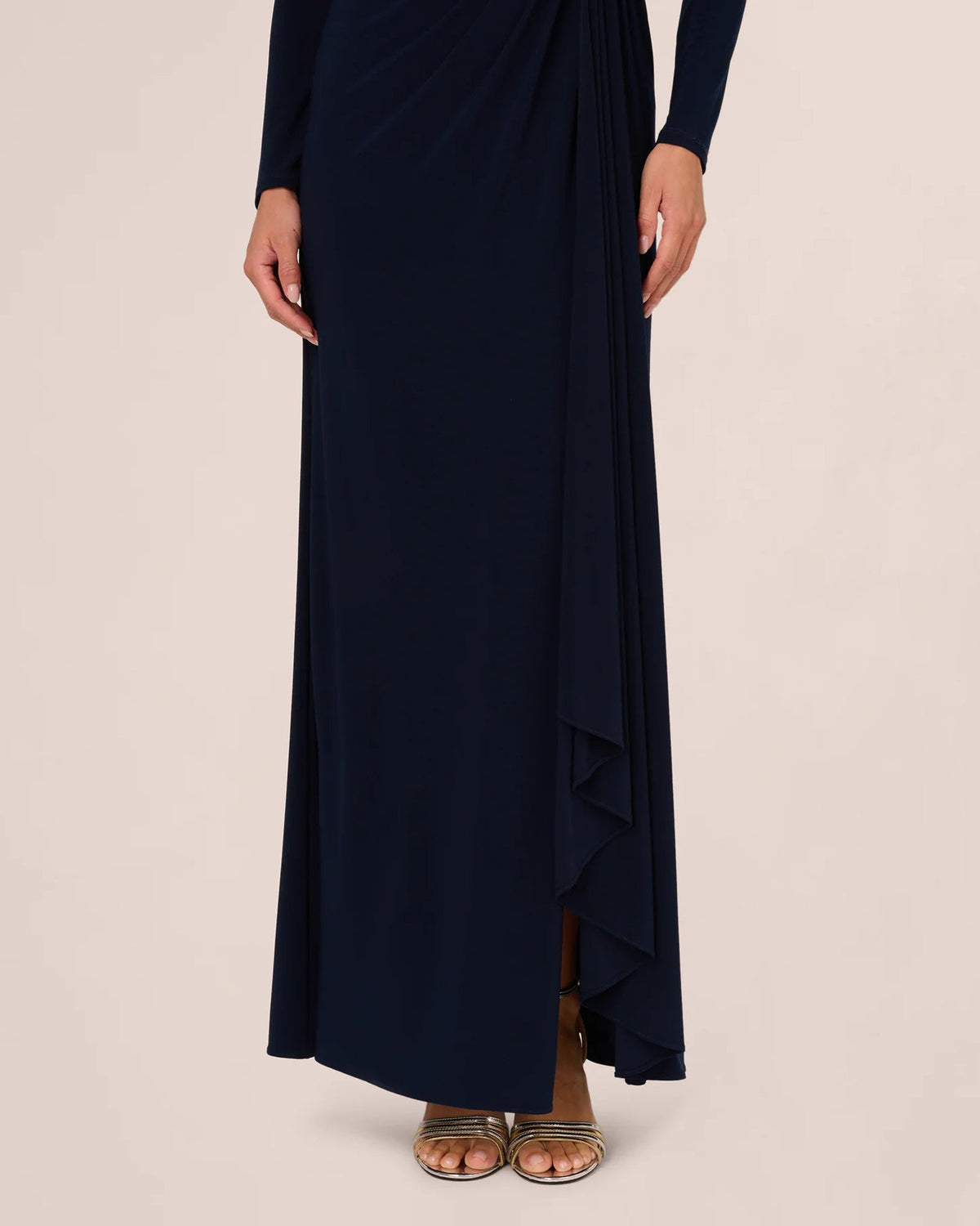 Midnight blue draped maxi dress with long sleeves and side slit with cascading overlay