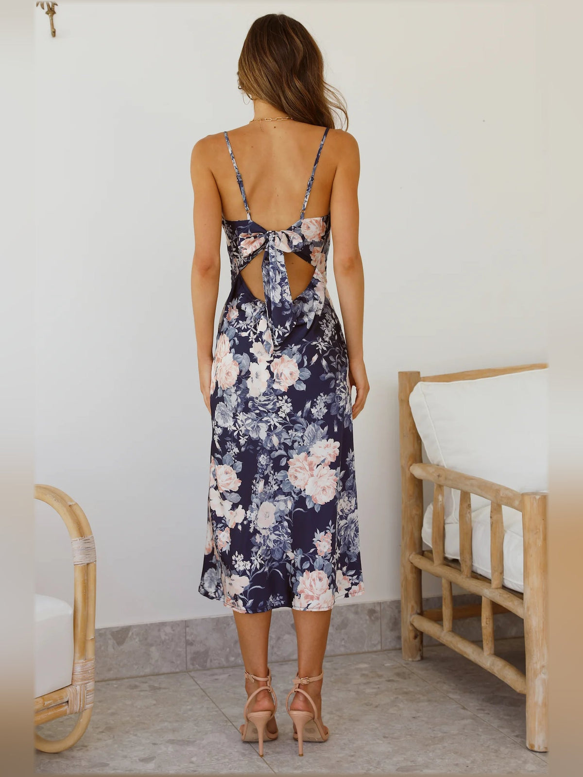 Blue floral midi formal dress with open back bow and thin spaghetti straps