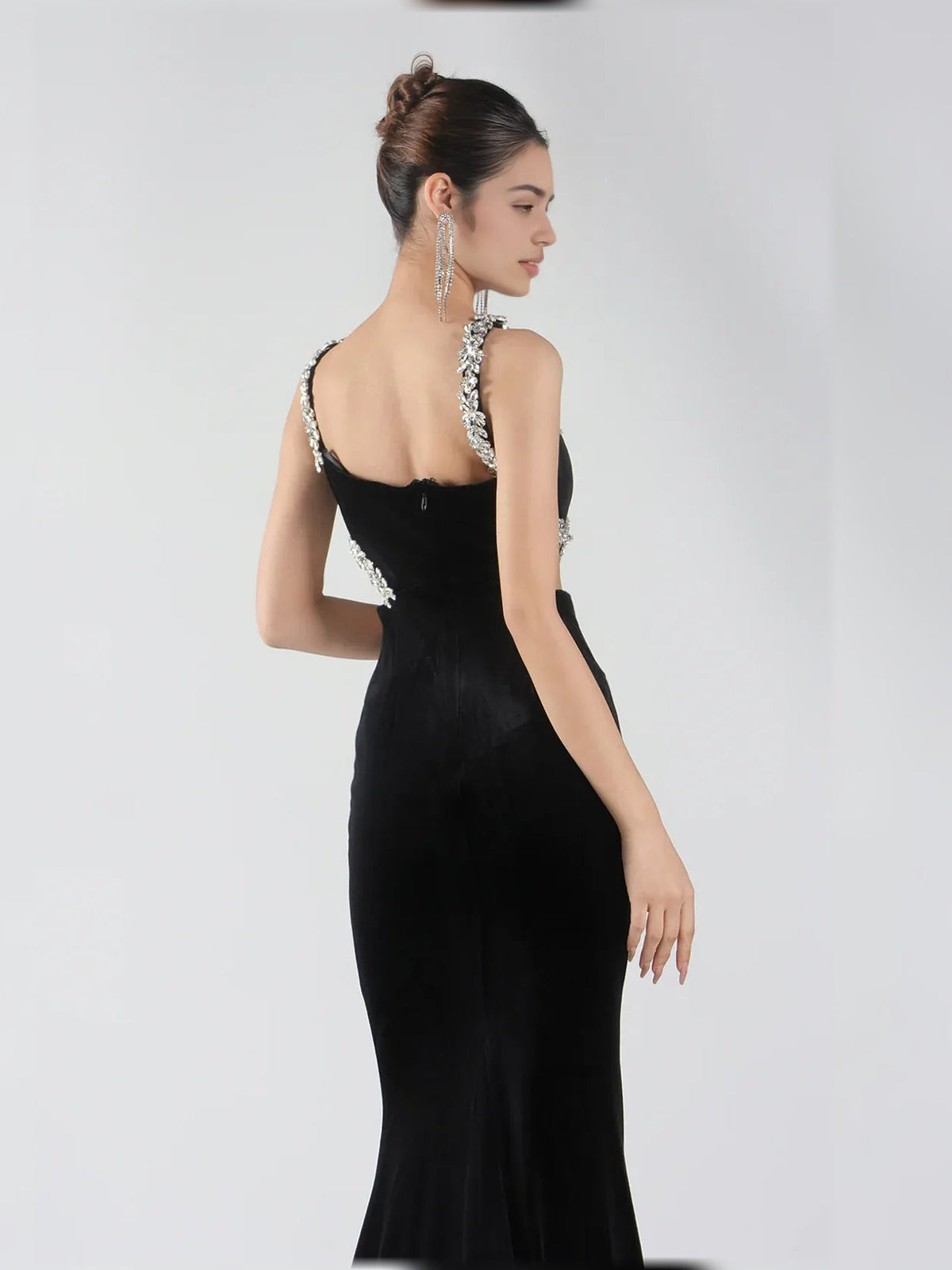 Black halter neck floor-length dress with open back and silver beaded shoulder accents