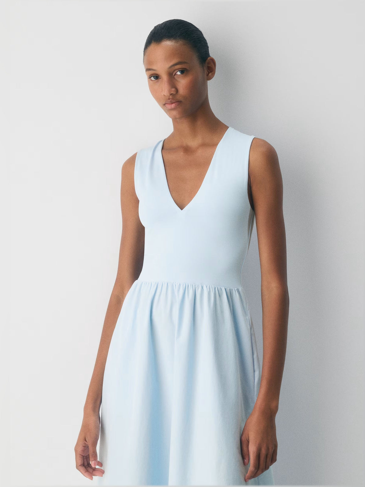 Teal sleeveless V-neck midi dress with gathered waist detail