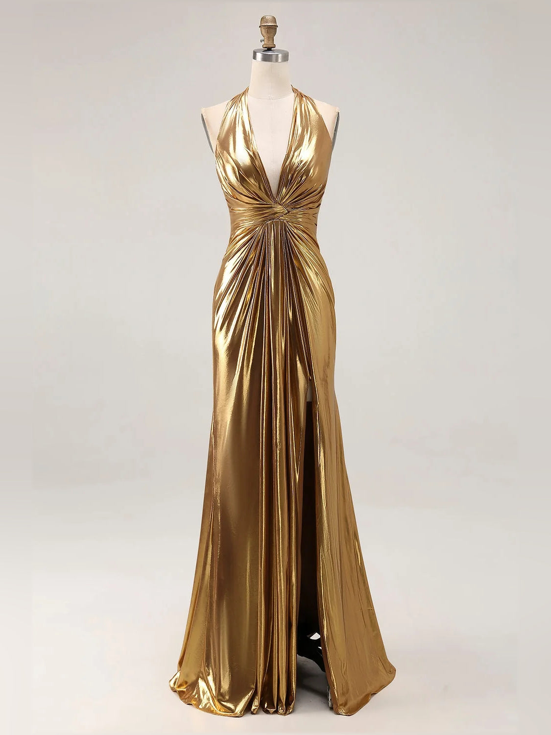 Gold ruched V-neck halter prom dress on mannequin with front thigh-high slit
