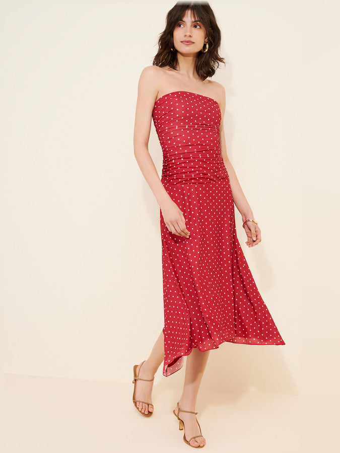 Red polka-dot strapless midi dress with ruched waist and side slit hem