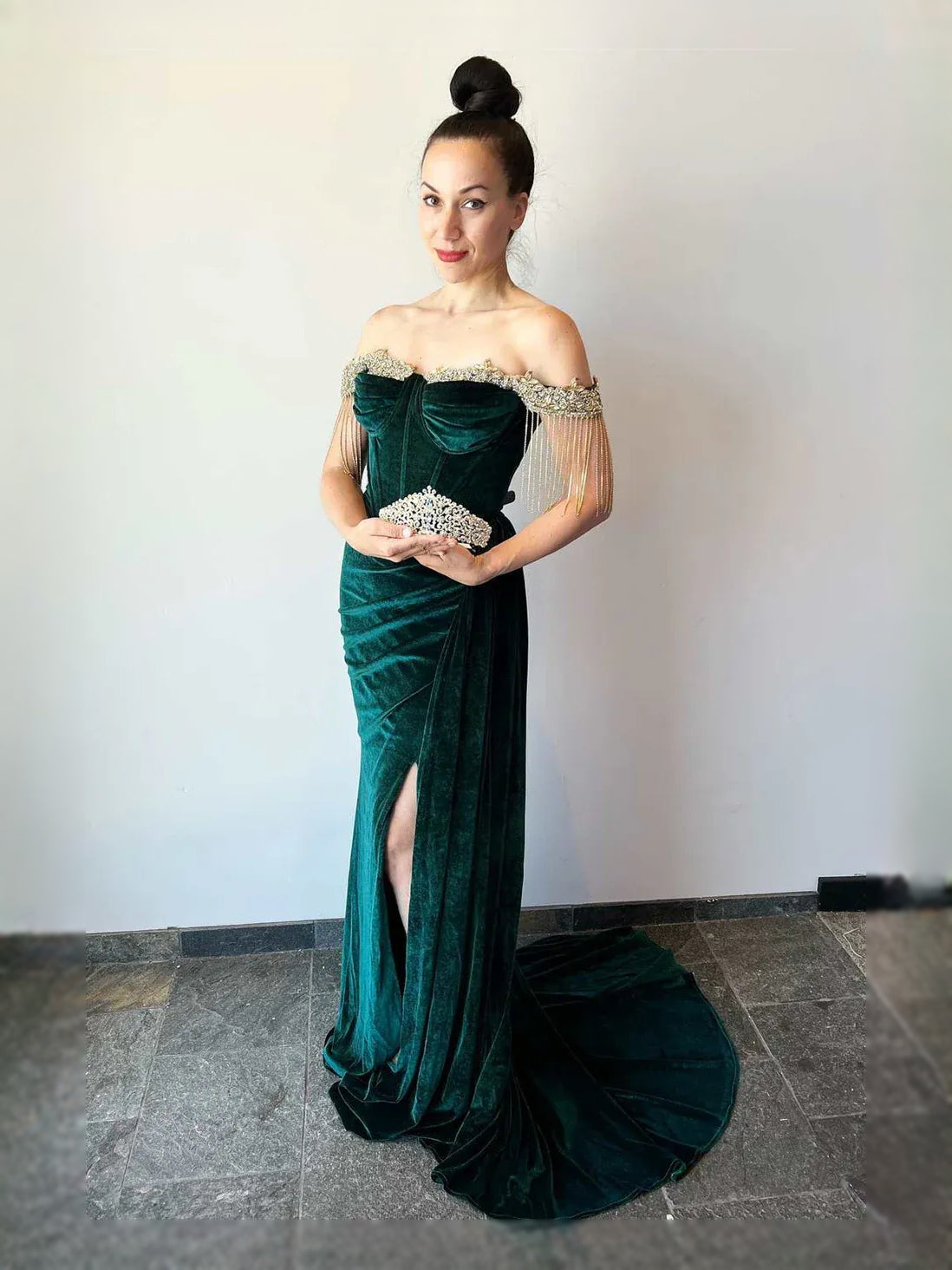 Emerald green velvet sweetheart mermaid prom dress with ruched bodice and rhinestone fringe