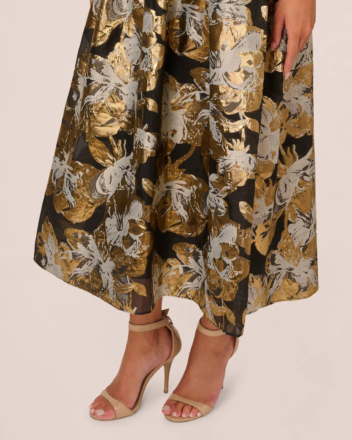 Gold-and-white floral A-line skirt with gathered waist and soft pleated flare