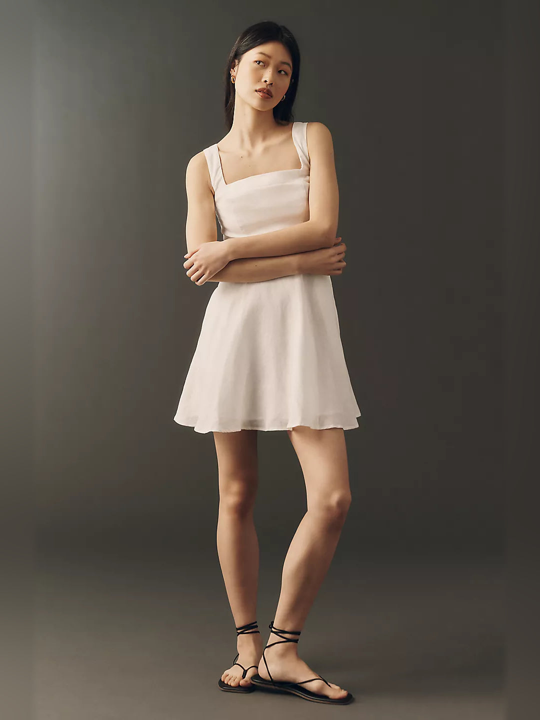 White sleeveless square-neck mini dress with flared skirt