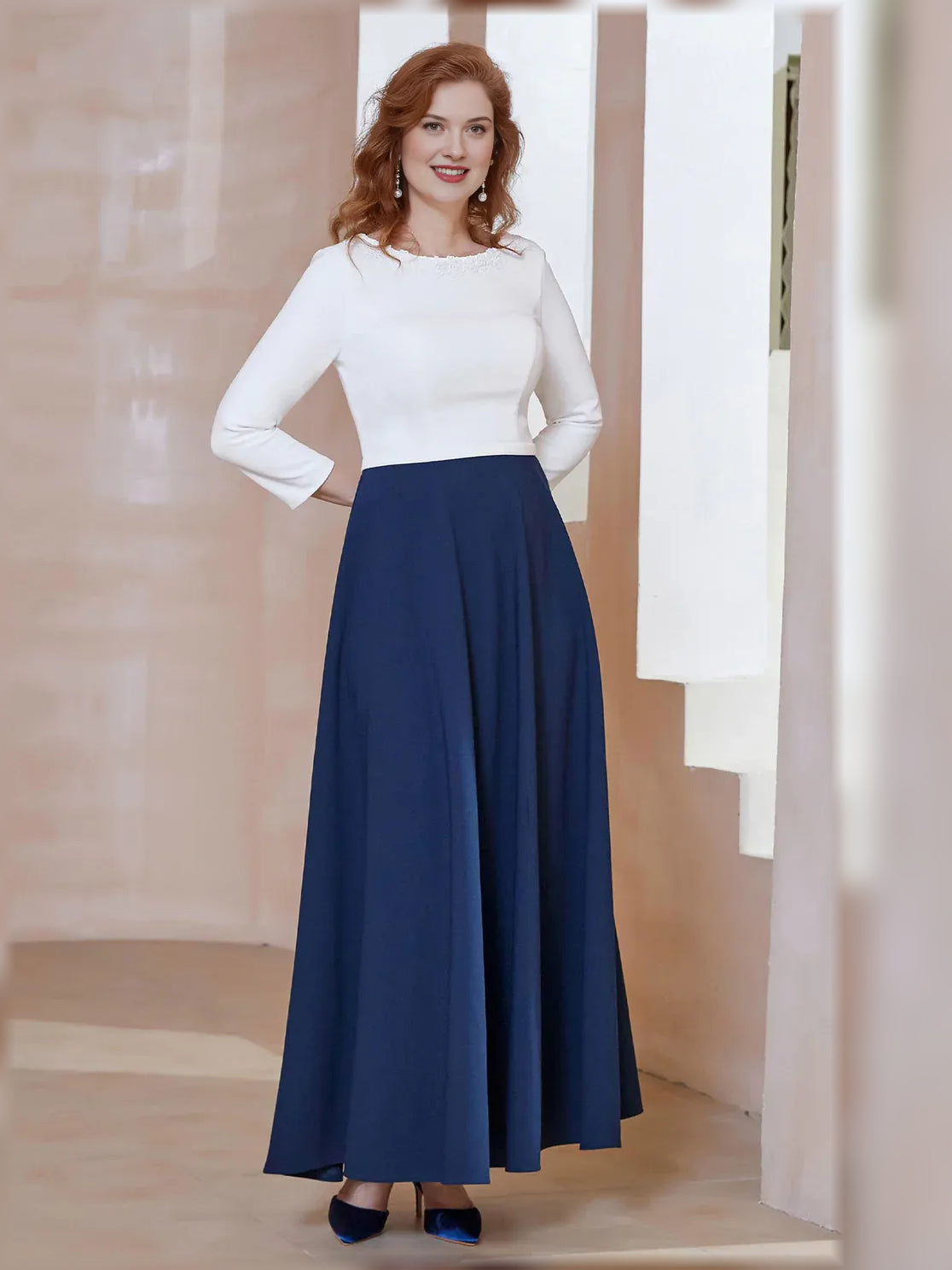 Mother of the bride A-line dress with boat neckline, navy pleated skirt and long white sleeves