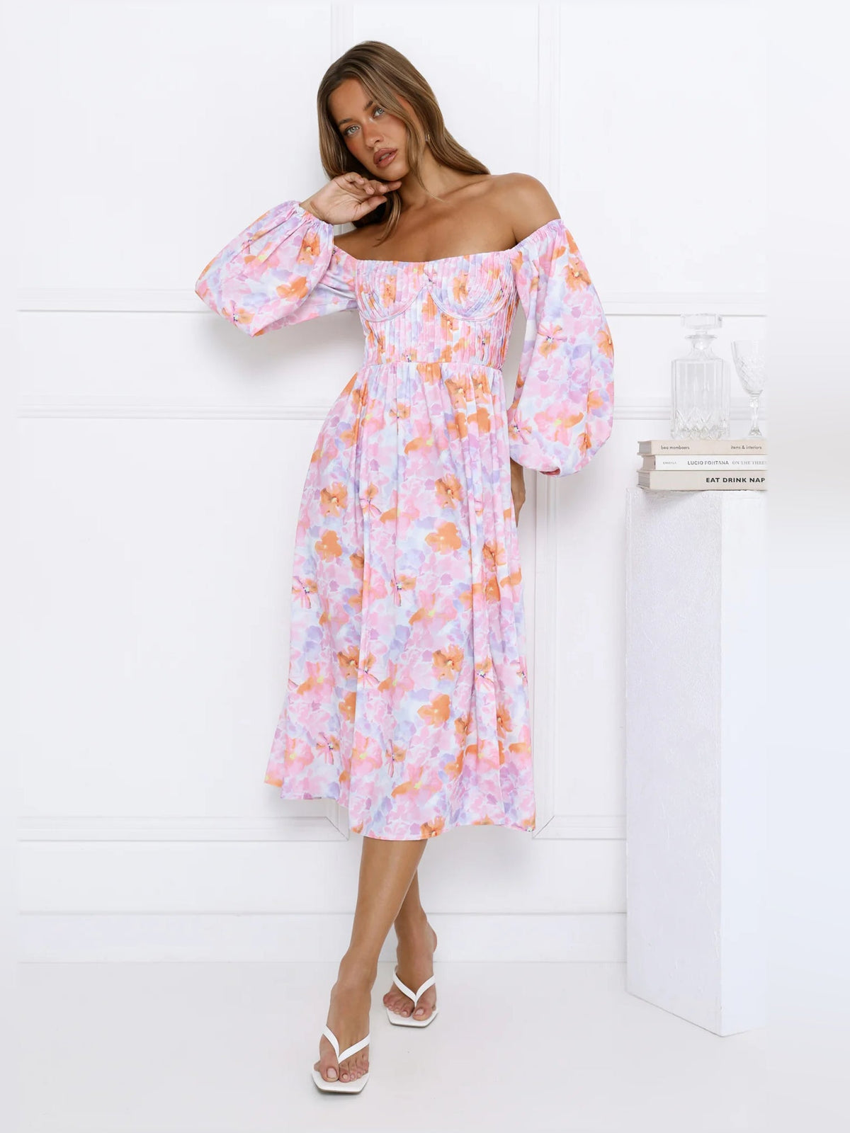 Pastel floral off-shoulder midi dress with puff sleeves and center front slit.