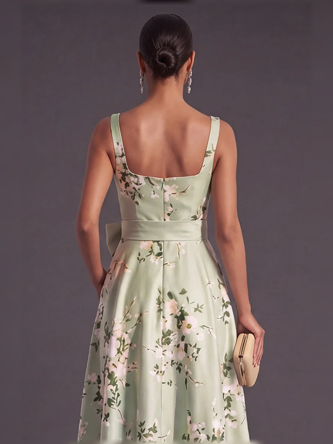 Sage green floral A-line dress with spaghetti straps, open back and fitted waist