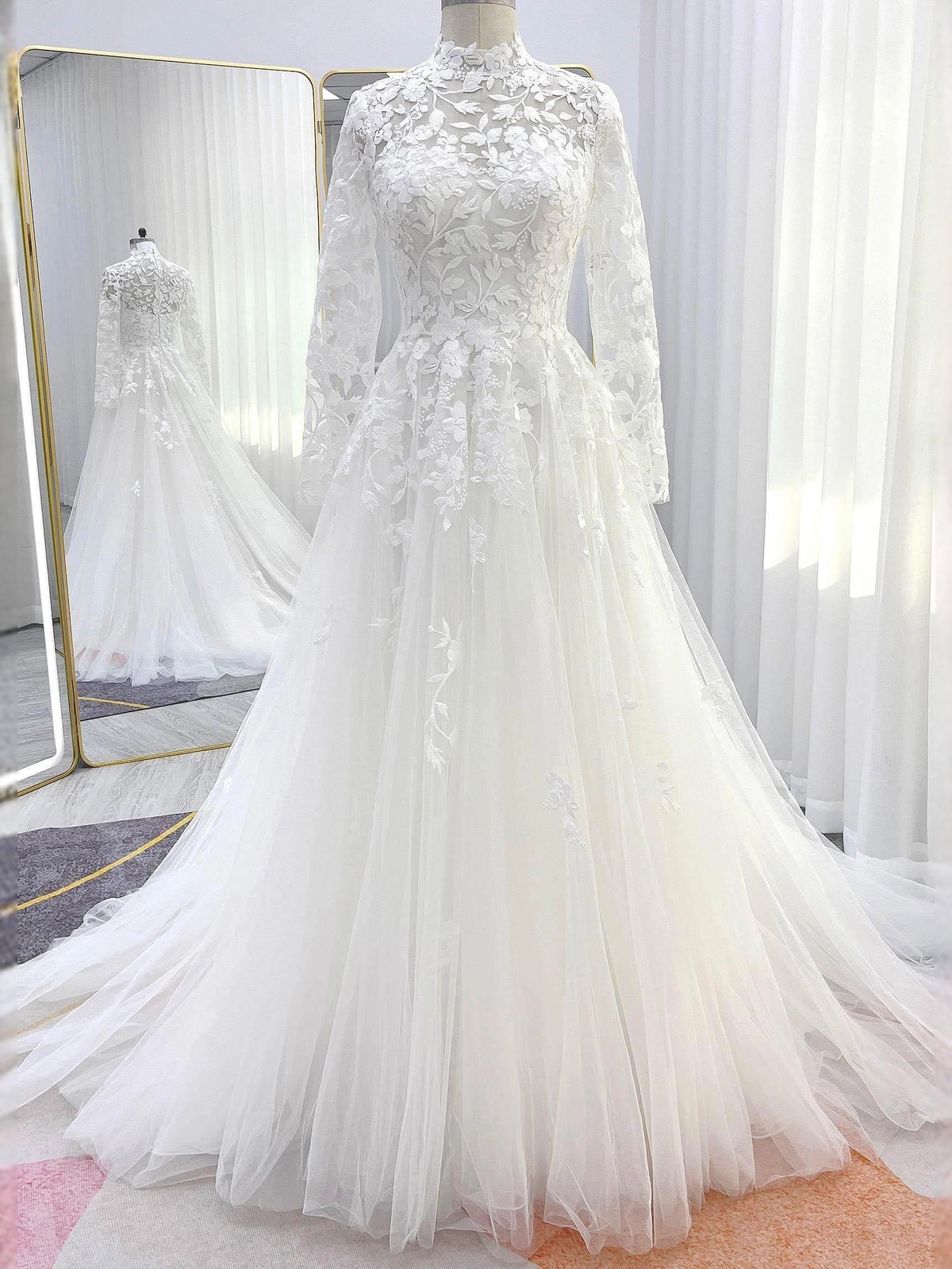 Ivory embroidered high-neck long-sleeve wedding dress with A-line tulle skirt, back view