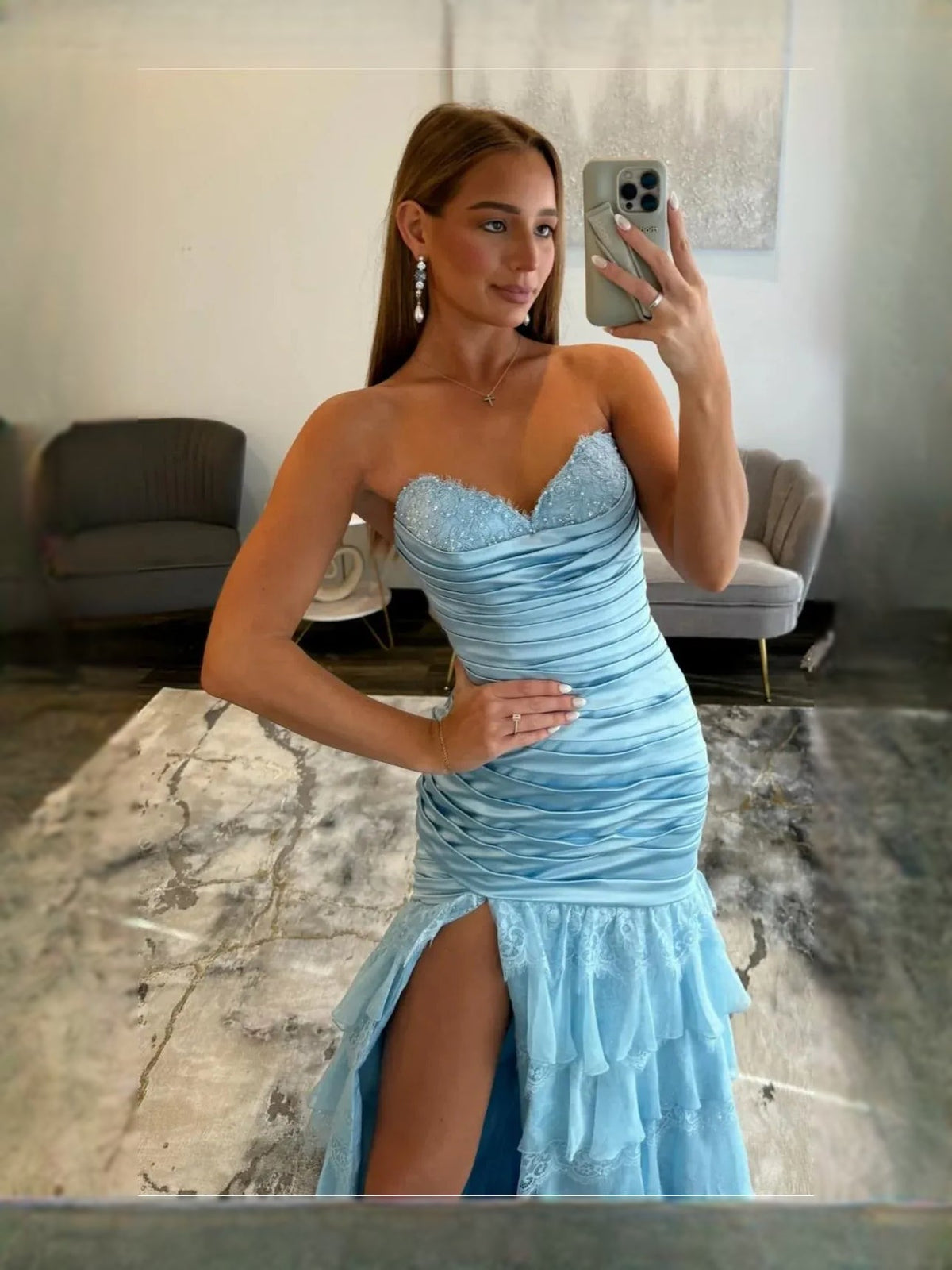 Light blue sweetheart corset prom dress with ruched bodice and ruffled tulle skirt