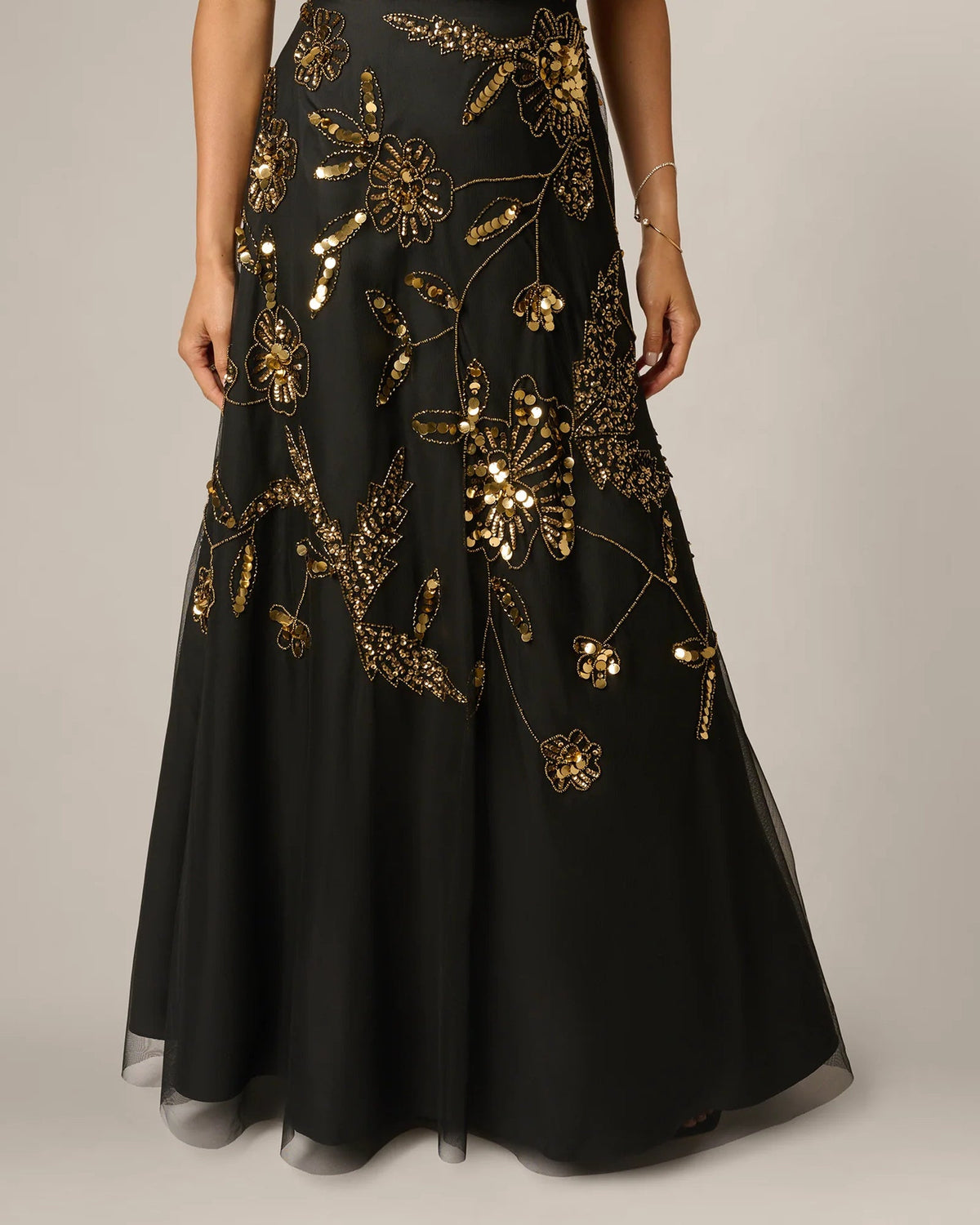Black A-line maxi skirt with gold vine and floral bead embroidery, full length