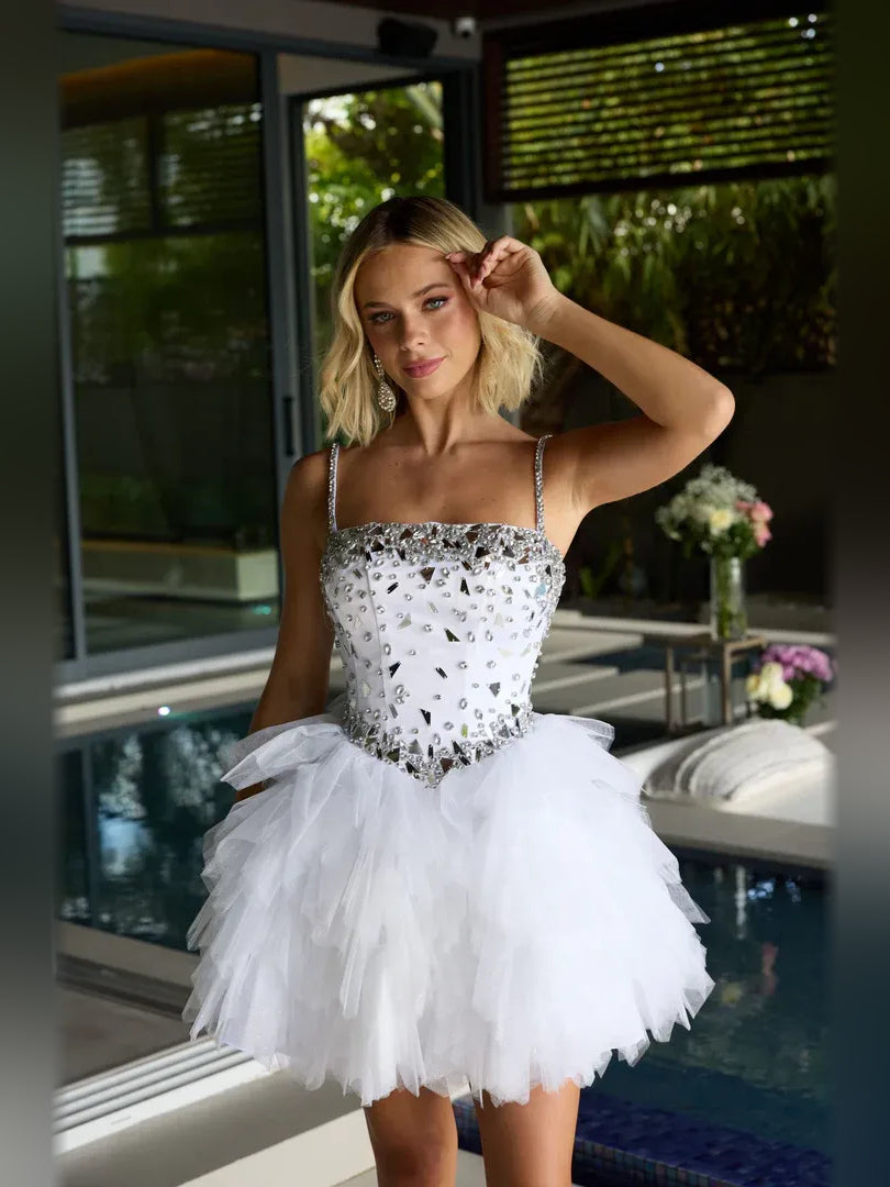 White beaded mini A-line tulle dress with straight neckline, spaghetti straps, tiered tulle skirt