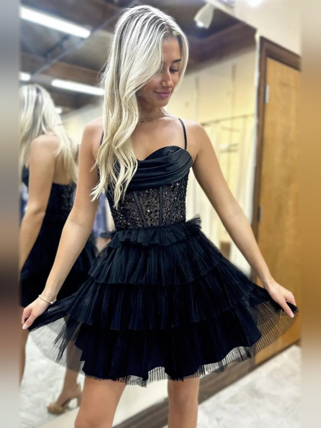 Black sweetheart corset mini dress with tiered ruffles and textured bodice