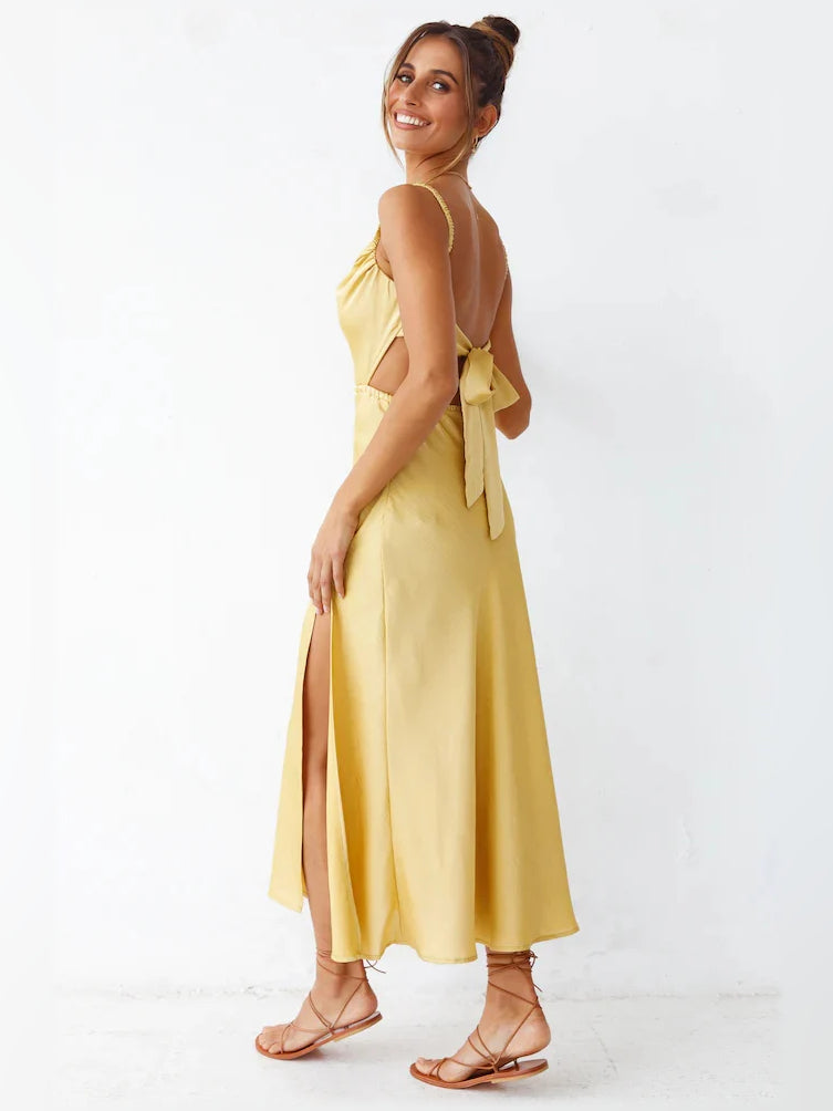 Yellow open-back midi formal dress with spaghetti straps and flowing skirt
