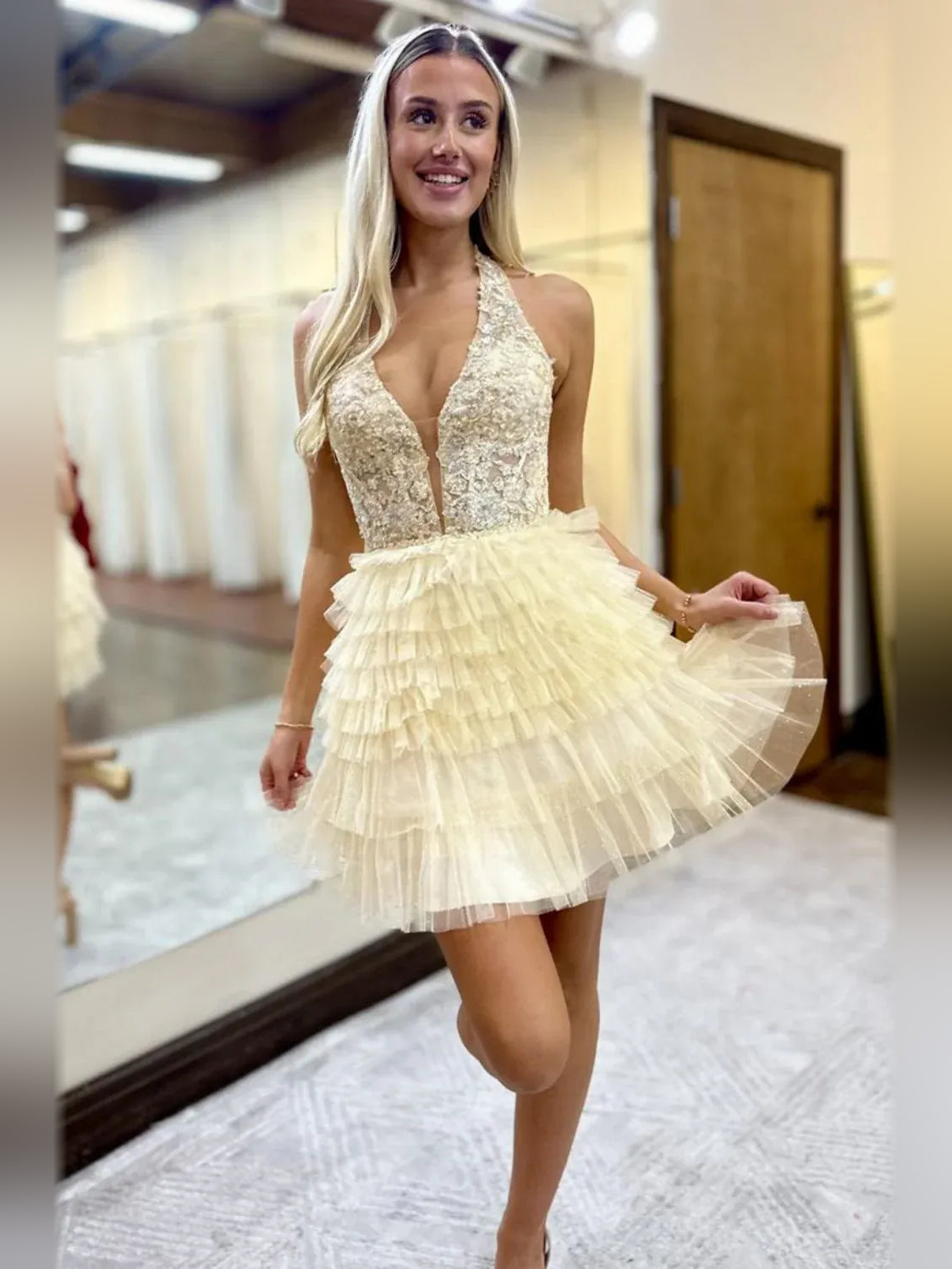 Pale lemon tiered tulle mini dress with deep V-neck bodice and ruffled skirt