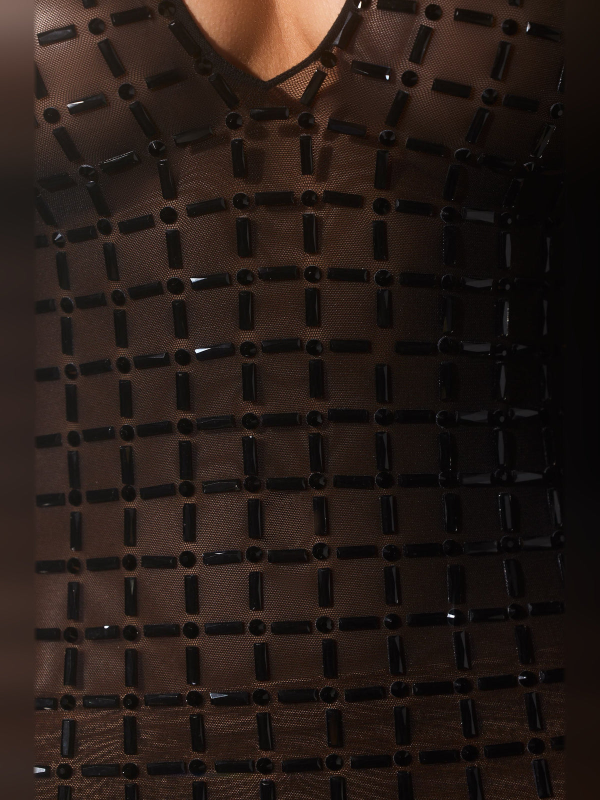 Black grid-pattern dress fabric with reflective square details
