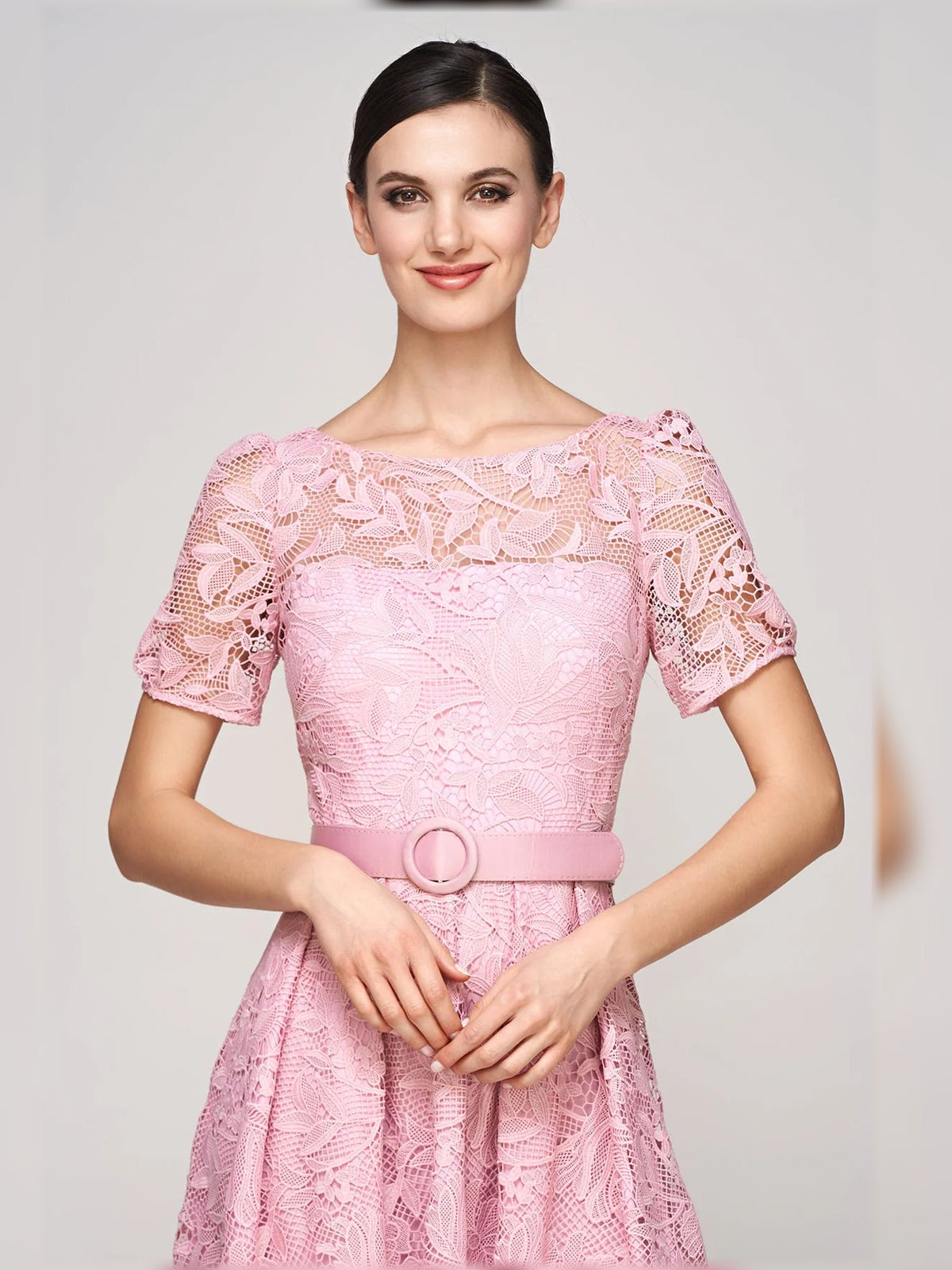 Pink floral lace dress with square neckline, short puff sleeves, and waist belt