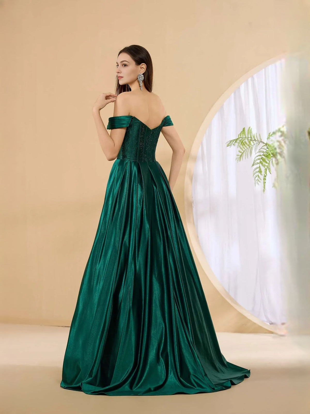 Off-shoulder corset formal dress in dark green with pleated floor-length skirt