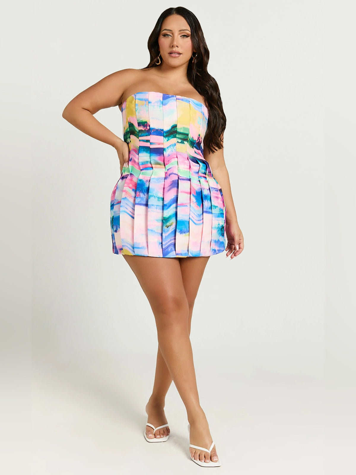 Corset-style strapless mini homecoming dress in colorful watercolor print, A-line silhouette