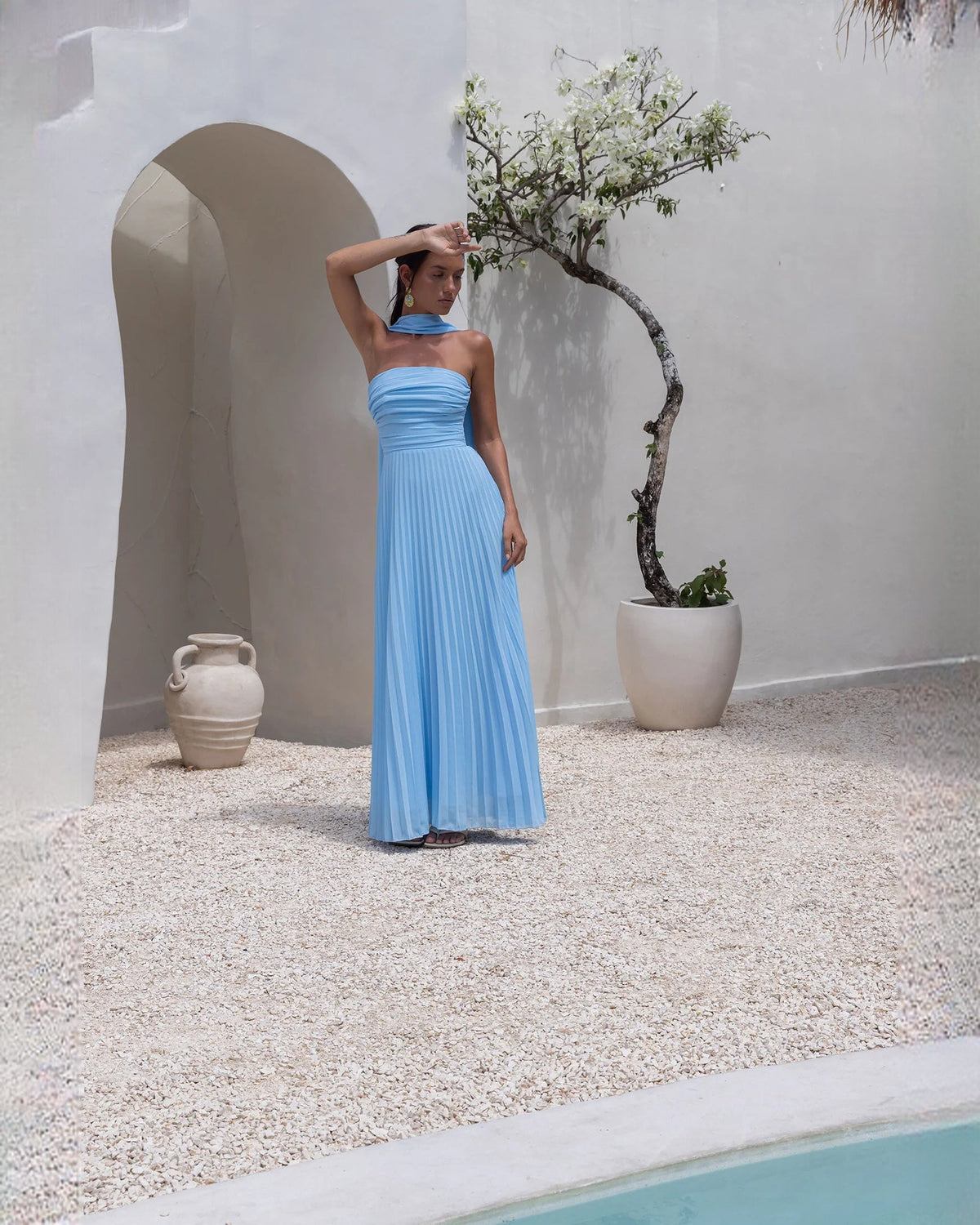 Blue strapless chiffon A-line maxi dress with neckline ruffle and pleated fabric