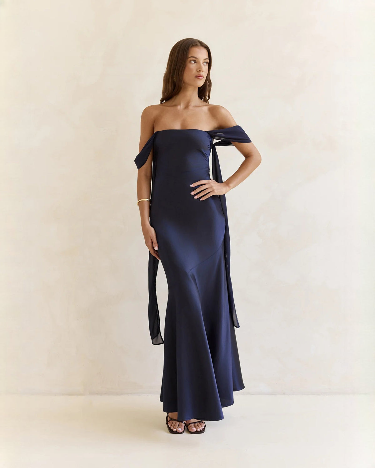 Navy satin off-shoulder A-line maxi dress with draped shoulder sash ties