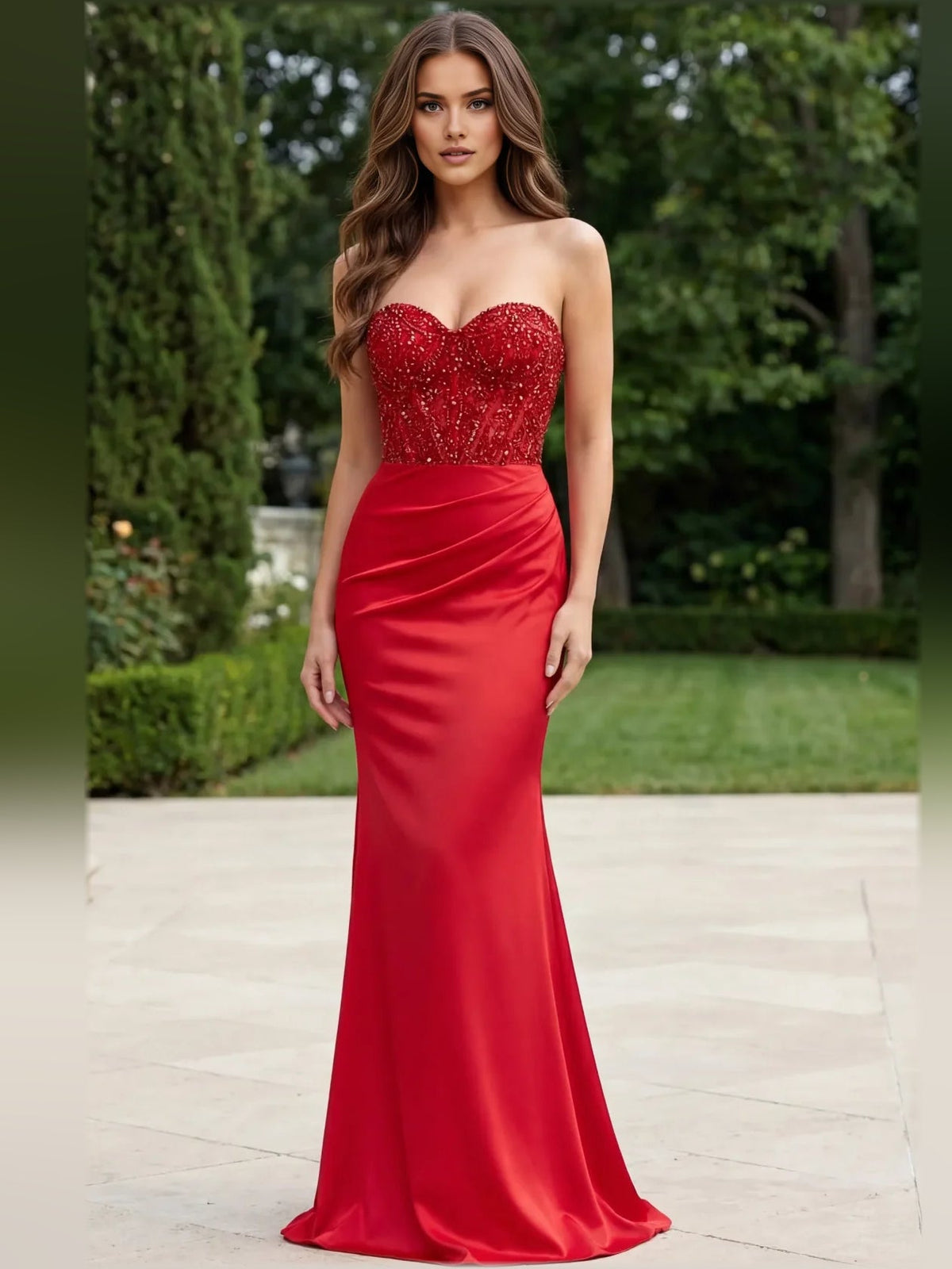 Red sweetheart corset evening gown with lace bodice, ruched waist, long flowing skirt