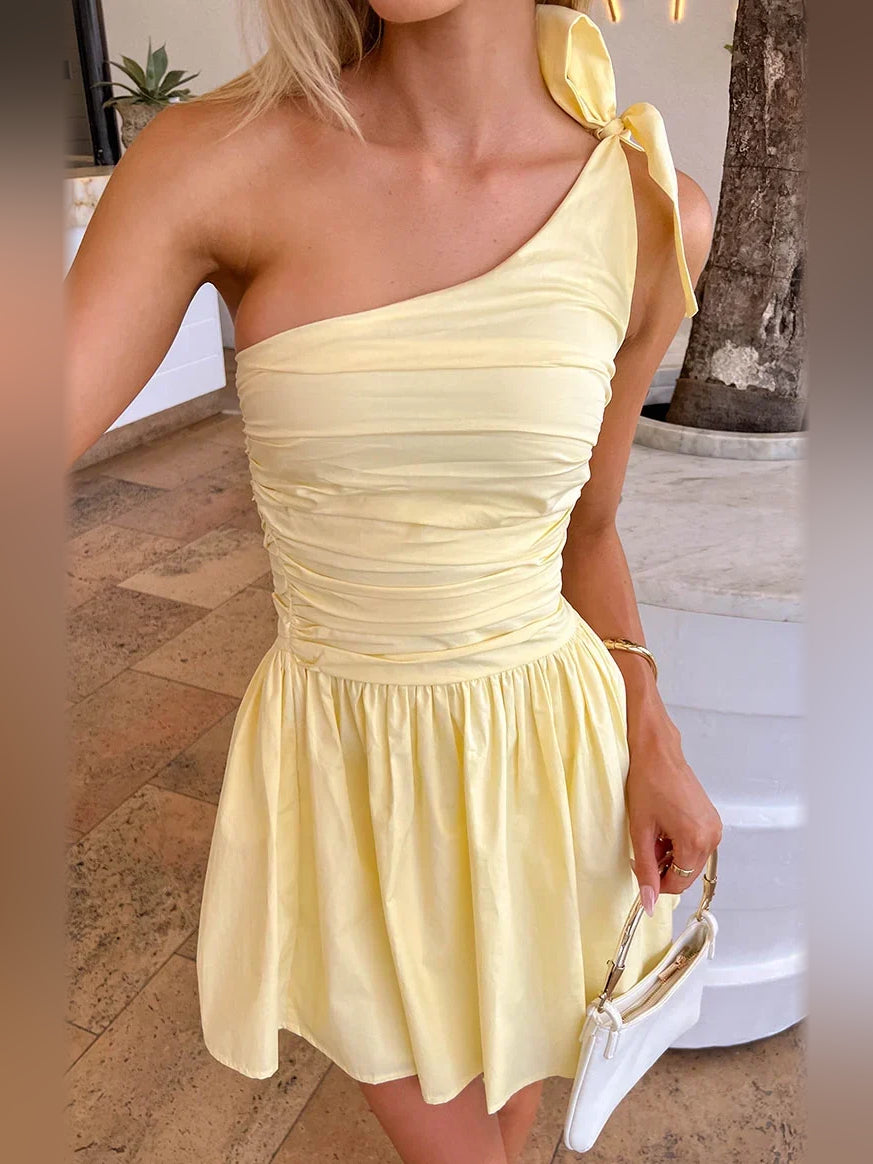 Canary one-shoulder mini dress with ruched texture and tied shoulder bow