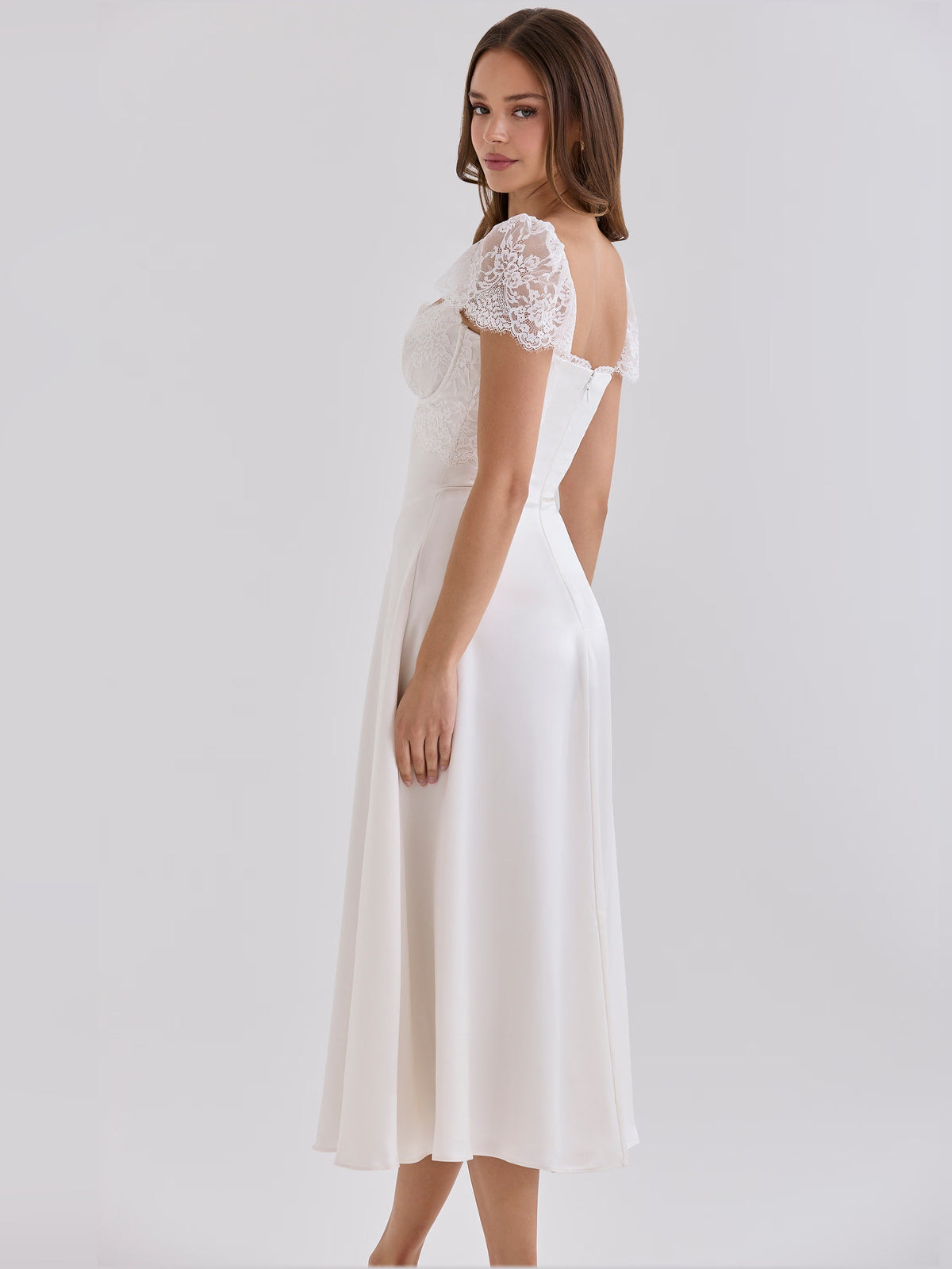 White satin midi dress with lace cap sleeves, fitted bodice, and flared skirt