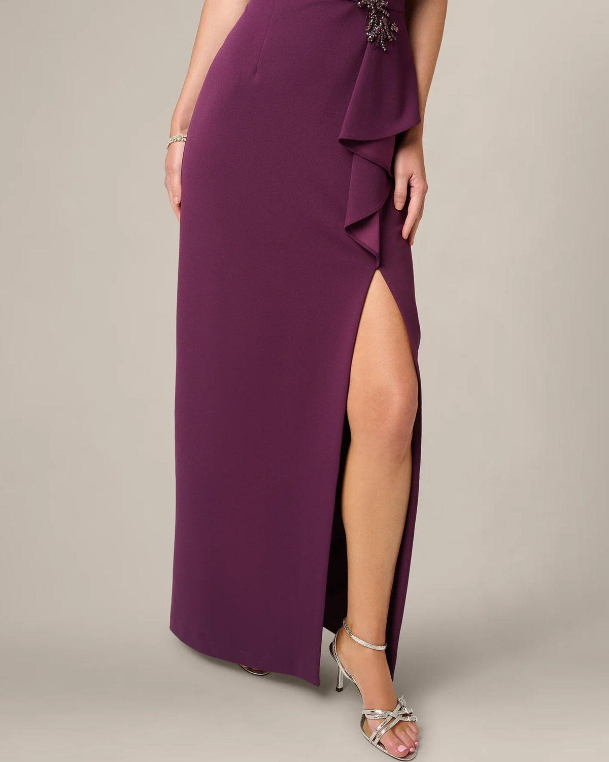 Plum wine maxi skirt with side slit and layered ruffle drape at hip