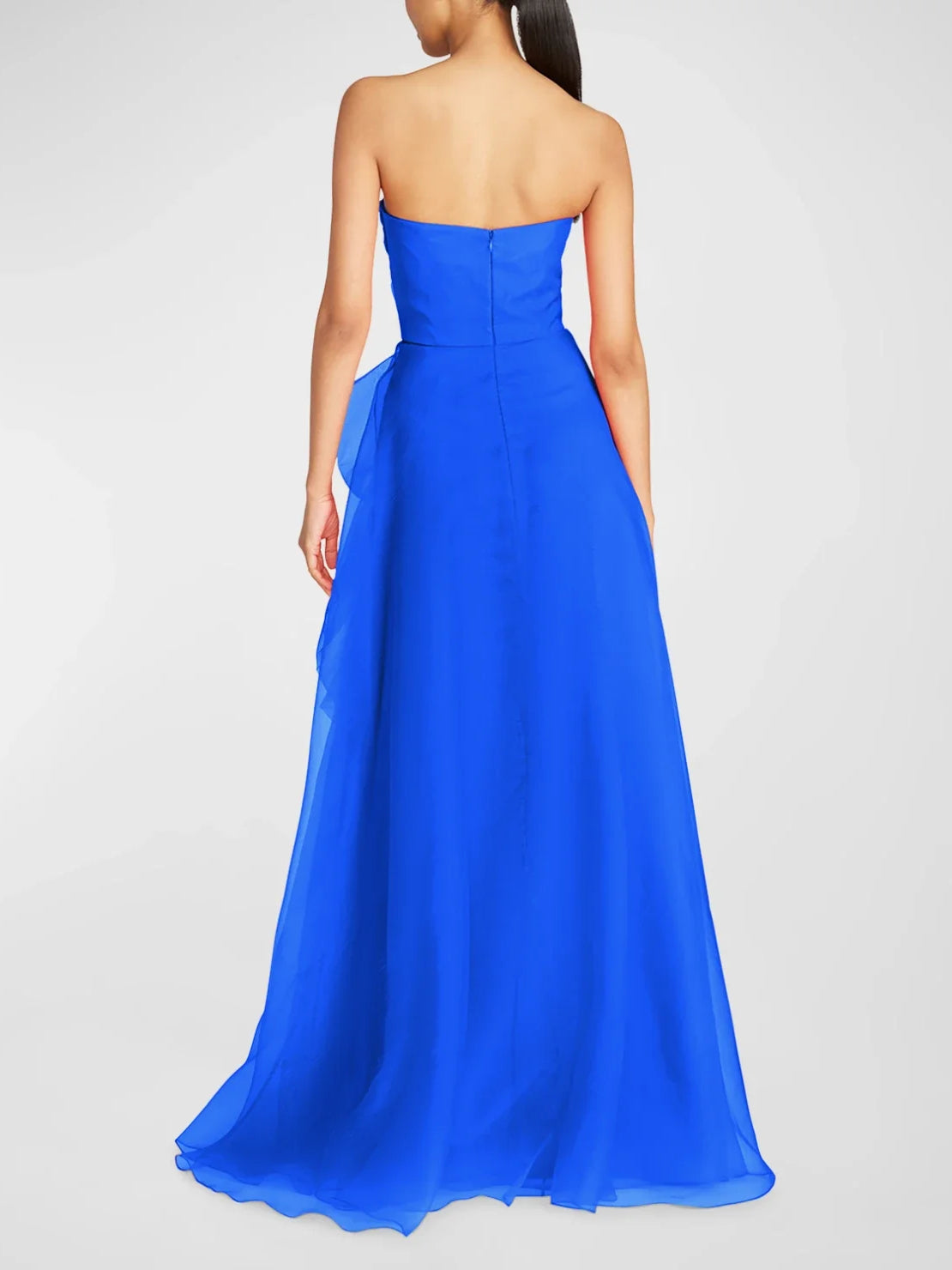 Cobalt blue strapless A-line formal dress from back, structured bodice and full hem.