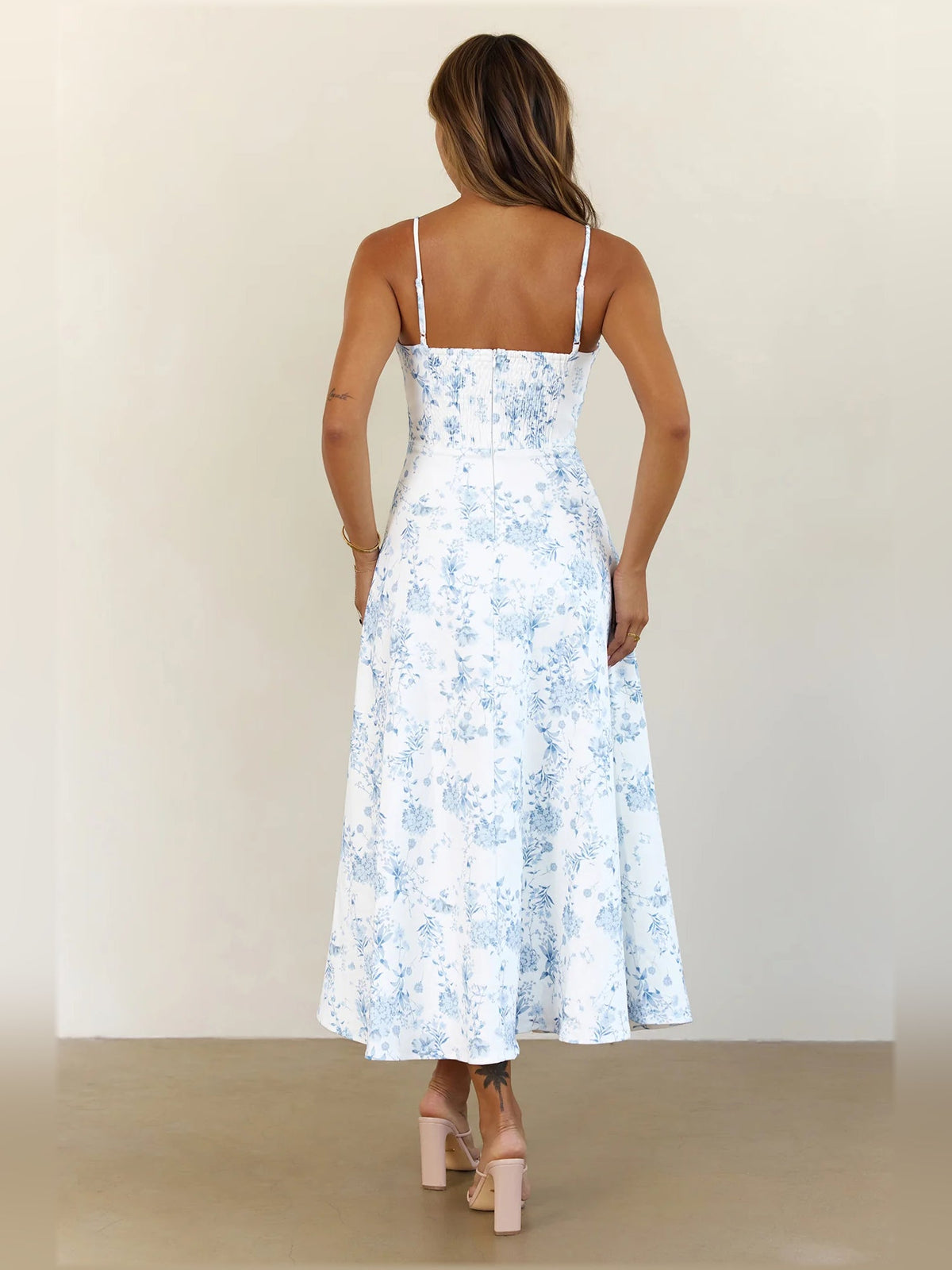 Light blue floral midi dress, open back with thin spaghetti straps and tiered skirt