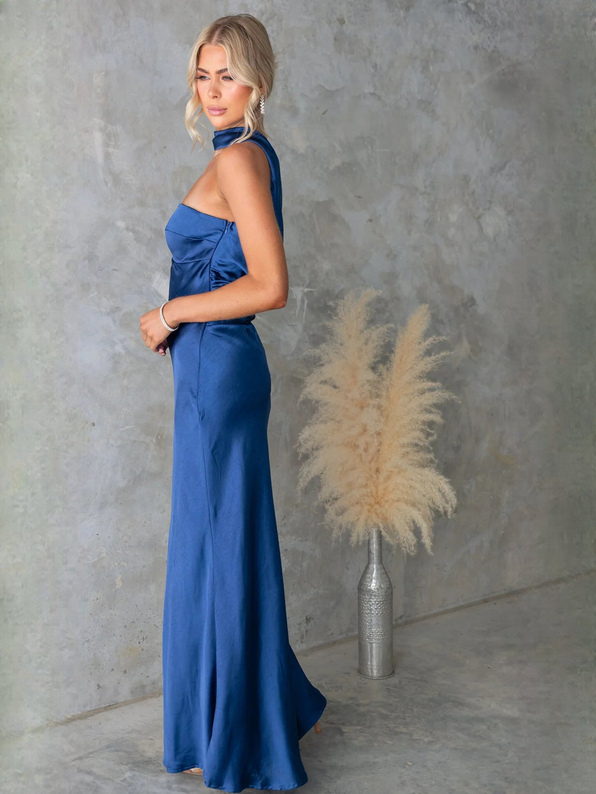 Royal blue satin halter-neck maxi dress with ruched bodice and fitted skirt