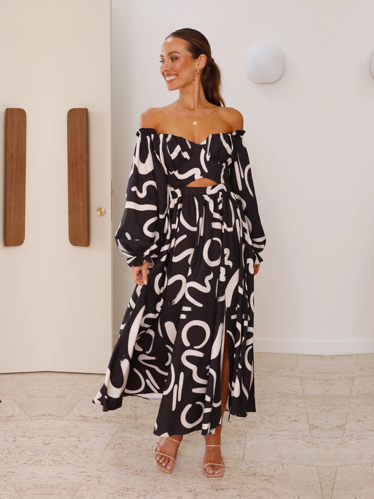 Black a-line maxi formal dress with skirt slit, alternate view showing the waist