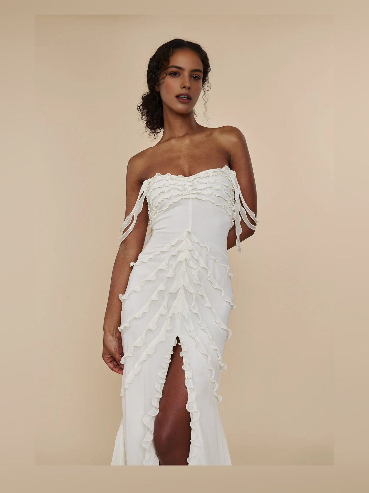 Ivory sweetheart prom dress with off-shoulder layered ruffles and thigh slit, front view
