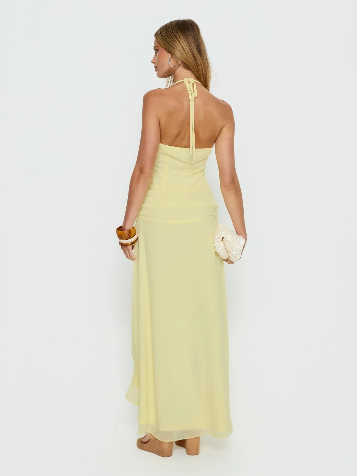 Yellow formal dress with asymmetrical detailing